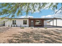 Charming single-story home featuring a desert landscape and covered parking at 1653 E Palmcroft Dr, Tempe, AZ 85282