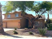 Two-story home with desert landscaping, brick accents, and a spacious two-car garage at 1838 W Enfield Way, Chandler, AZ 85286