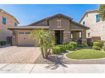 Attractive single-story home with a well-manicured front yard, lush landscaping, and a paved driveway at 277 E Kaibab Dr, Chandler, AZ 85249