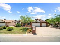 Charming single-story home with brick accents, well-maintained landscaping, and a two-car garage at 4353 W Villa Rita Dr, Glendale, AZ 85308