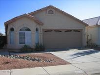 Charming single-story home with well-manicured landscaping and a two-car garage at 4533 E Glenhaven Dr, Phoenix, AZ 85048