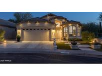 Charming one-story home with landscaped front yard, brick driveway, and a two-car garage at 4605 E Swilling Rd, Phoenix, AZ 85050