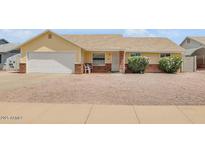 Charming single-story home with a well-maintained gravel front yard and an attached two-car garage at 6102 E Inglewood St, Mesa, AZ 85205