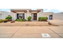 Charming single-story home featuring manicured landscaping and a welcoming front entrance at 919 E Villa Maria Dr, Phoenix, AZ 85022