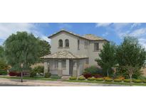 Charming two-story home with tiled roof and covered porch, surrounded by lush landscaping at 13498 N 156Th Dr, Surprise, AZ 85379