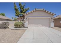 Charming single-story home featuring a neutral facade and a two-car garage at 15364 W Acapulco Ln, Surprise, AZ 85379
