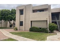 A well maintained exterior of the two-story condo with green lawn at 1920 W Lindner Ave # 222, Mesa, AZ 85202