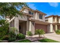 Charming two-story home with desert landscaping, a covered front patio, and a two-car garage at 3128 E Tina Dr, Phoenix, AZ 85050