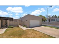 Charming home featuring a private gate, attached garage, and well-maintained front yard at 3345 E University Dr # 47, Mesa, AZ 85213