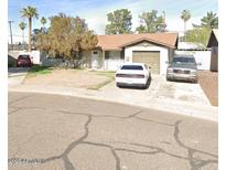 Charming single-story home featuring a garage and driveway for multiple cars at 3562 W Seldon Ln, Phoenix, AZ 85051
