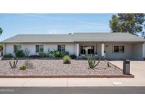 Charming single-story home featuring desert landscaping, a welcoming front porch, and a well-maintained exterior at 3759 E Charter Oak Rd, Phoenix, AZ 85032