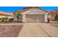Charming single-story home featuring a two-car garage and low-maintenance desert landscaping at 4515 E Verbena Dr, Phoenix, AZ 85044