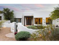 Stunning Santa Fe home with beautiful desert landscaping and a charming front entrance, perfect for luxury living at 8601 E De La O Rd, Scottsdale, AZ 85255