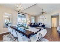 Open-concept living area with a dining table and modern decor, creating a bright and inviting atmosphere at 15252 N 100Th St # 2157, Scottsdale, AZ 85260