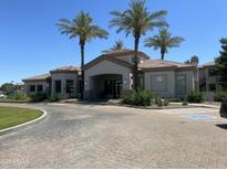 Elegant clubhouse entrance with desert landscaping and paved entry at 1941 S Pierpont Dr # 1014, Mesa, AZ 85206