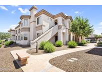 Attractive stucco condo building featuring private entrances, desert landscaping, and shaded parking at 1941 S Pierpont Dr # 1014, Mesa, AZ 85206