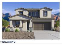 Charming two-story home with desert landscaping, paired with a multi-car garage and mountain views at 27382 N 69Th Dr, Peoria, AZ 85383