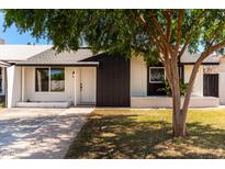 Charming single-story home features a well-maintained lawn and inviting front entrance at 4147 W Reade Ave, Phoenix, AZ 85019