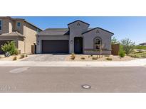 Charming single-story home featuring desert landscaping, a two car garage and neutral color palette at 5954 E Cat Balue Dr, Phoenix, AZ 85054