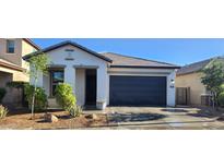 Charming single-story home with a well-maintained front yard, covered entryway, and a two-car garage at 6621 E Villa Rita Dr, Phoenix, AZ 85054
