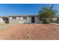 Charming single-story home with a low-maintenance rock front yard at 7619 W Clarendon Ave, Phoenix, AZ 85033