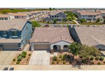 Aerial view of charming single-Gathering home featuring a tile roof and neat desert landscaping at 9921 E Acceleration Dr, Mesa, AZ 85212