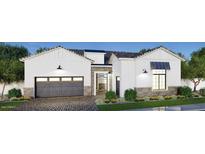 Stunning single-Gathering home showcasing a brick-accented facade, pristine landscaping, and a welcoming two-car garage at 1180 E Peach Tree Dr, Chandler, AZ 85249