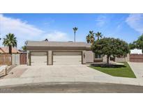Charming home featuring a two-car garage and well-maintained landscaping at 1670 E Whitten St, Chandler, AZ 85225
