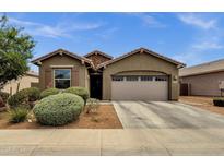 Charming single-story home featuring a well-manicured yard and a spacious two-car garage at 1725 E Chanute Pass --, Phoenix, AZ 85040
