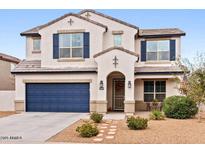 Beautiful two-story home showcasing a well-maintained front yard and a two-car garage at 18309 N Crestview Ln, Maricopa, AZ 85138