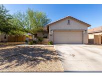Charming single-story home featuring a two-car garage and low maintenance front yard at 19342 W Morning Glory Dr, Buckeye, AZ 85326