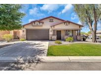 Charming single-story home with desert landscaping, covered porch and a two car garage at 209 E Diamond Trl, San Tan Valley, AZ 85143