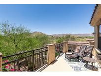 Relax on this balcony with wrought iron railing offering scenic views of the mountain landscape and golf course at 3554 N Hooper St, Buckeye, AZ 85396