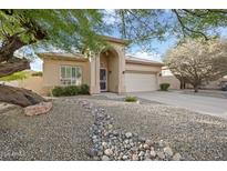 Charming single-story home with desert landscaping, arched entry and two car garage at 4462 E Dale Ln, Cave Creek, AZ 85331