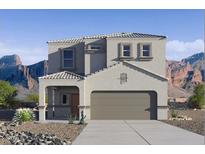 Beautiful two-story home with a neutral color scheme and a mountain backdrop at 4999 E Umber Rd, San Tan Valley, AZ 85143
