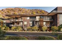 Modern condo exterior featuring balconies with mountain views and desert landscaping for an inviting outdoor living experience at 5050 N Camelback Ridge Dr # 2101, Scottsdale, AZ 85251