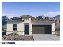 A charming single-story home with a stucco facade, stone accents, and a two-car garage at 7378 W Buckhorn Trl, Peoria, AZ 85383