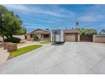 Charming single-story home with a large driveway and well-maintained front yard at 10601 N 36Th St, Phoenix, AZ 85028