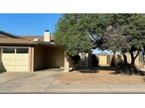 Charming single-story home with a well-maintained front yard and attached garage at 13041 N 51St Dr, Glendale, AZ 85304