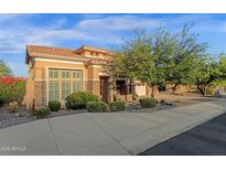 Beautiful single-Gathering home featuring a desert landscape, stone accents, and a tile roof with a two-car garage at 16401 S 29Th Ave, Phoenix, AZ 85045