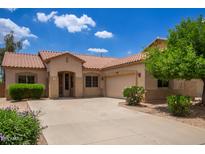 Charming single-story home with desert landscaping, spacious driveway, and a two-car garage at 19319 E Thornton Rd, Queen Creek, AZ 85142