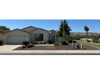 Charming single-story home with well-maintained landscaping and a two-car garage at 2013 E Valencia Dr, Phoenix, AZ 85042