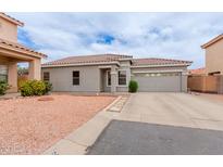 Charming single-story home with a tile roof, desert landscaping, and a two-car garage at 2326 E Spruce Dr, Chandler, AZ 85286