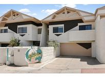 Unique townhome showcasing desert landscaping, architectural details, and a private entrance at 33 W Missouri Ave # 17, Phoenix, AZ 85013