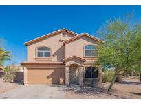 Two-story home featuring a 2-car garage, neutral stucco, and low-maintenance desert landscaping under a bright blue sky at 3365 N Sunaire --, Mesa, AZ 85215