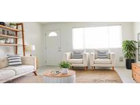 Bright living room featuring stylish furniture, decor, and natural light at 3556 W Augusta Ave, Phoenix, AZ 85051