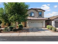 Inviting two-story home showcasing a neutral-toned exterior, well-manicured landscaping, and a spacious two-car garage at 3936 E Narrowleaf Dr, Gilbert, AZ 85298