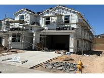 New two story home under construction with an attached two car garage and a concrete driveway at 7384 W Buckhorn Trl, Peoria, AZ 85383