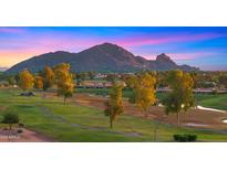 Scenic golf course view with mature trees and the McDowell Mountains in the background at sunset at 7424 N Via Camello Del Norte -- # 185, Scottsdale, AZ 85258