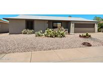 Charming single-story home featuring low-maintenance desert landscaping and a two-car garage at 772 Leisure World --, Mesa, AZ 85206